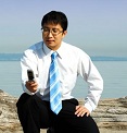 Man on the Beach checking Cell/Mobile